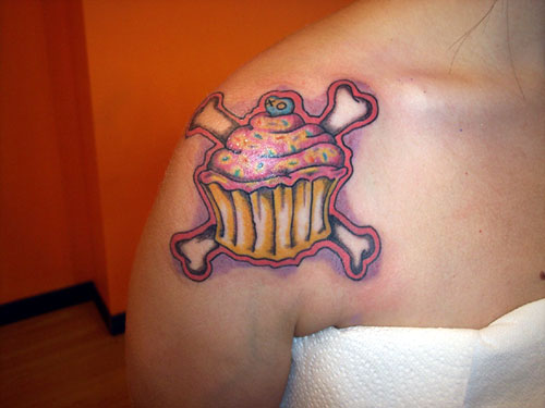 Danger Realistic Cupcake Tattoo On Girl Right Shoulder