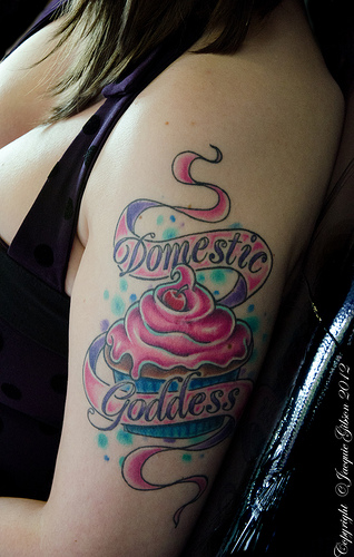 Domestic Goddess Banner With Cupcake Tattoo On Left Half Sleeve