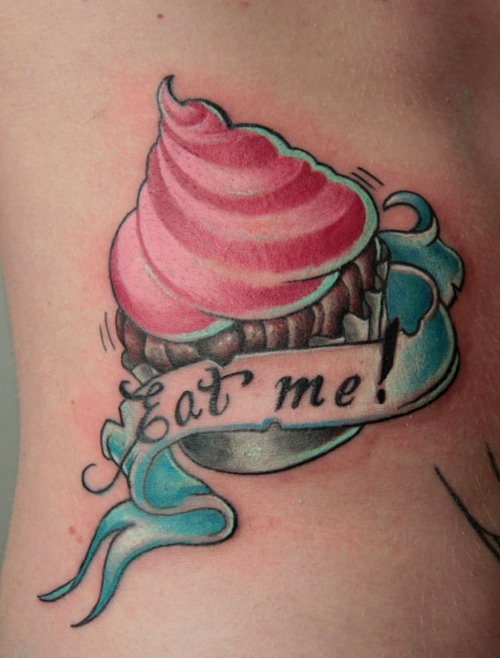 Eat Me Banner And Realistic Cupcake Tattoo On Side Rib
