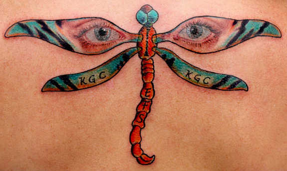 Eyes In Dragonfly Wings Tattoo On Back