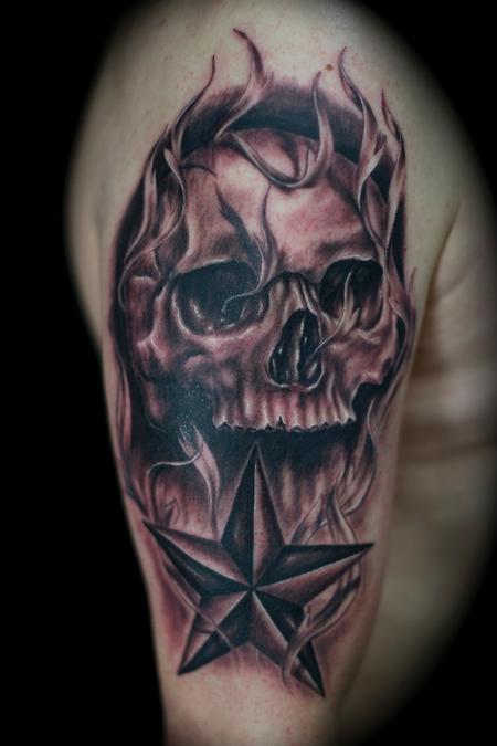 Flaming Skull And Star Tattoo On Right Half Sleeve