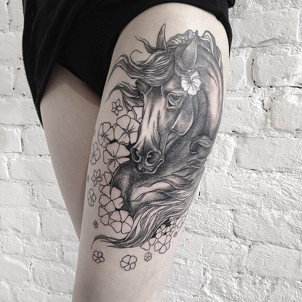 Flower And Grey Horse Tattoo On Girl Left Thigh