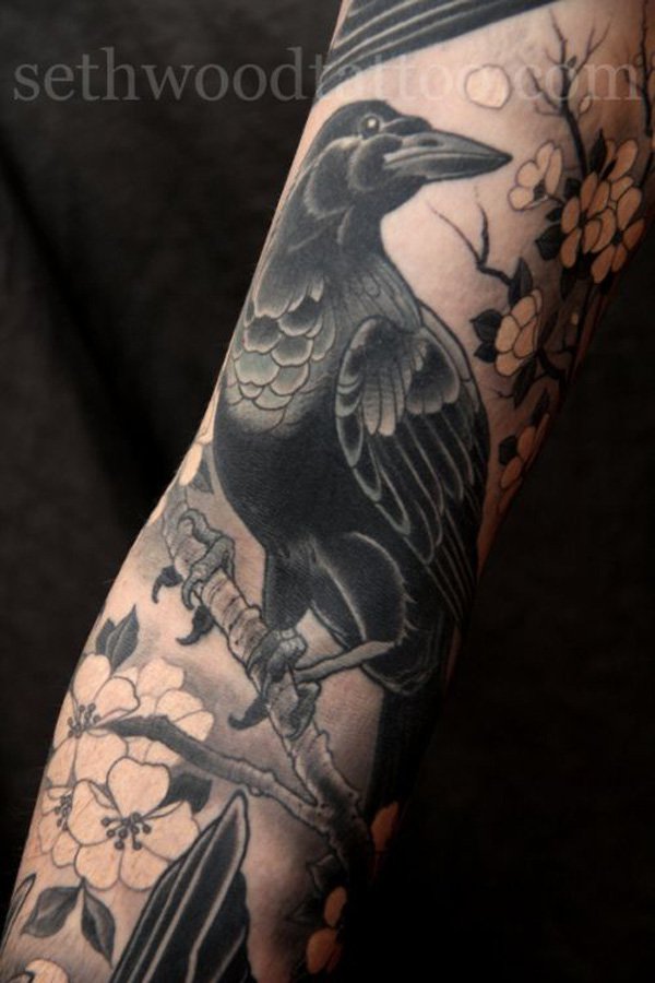Flowers And Black Raven Tattoo On Arm Sleeve