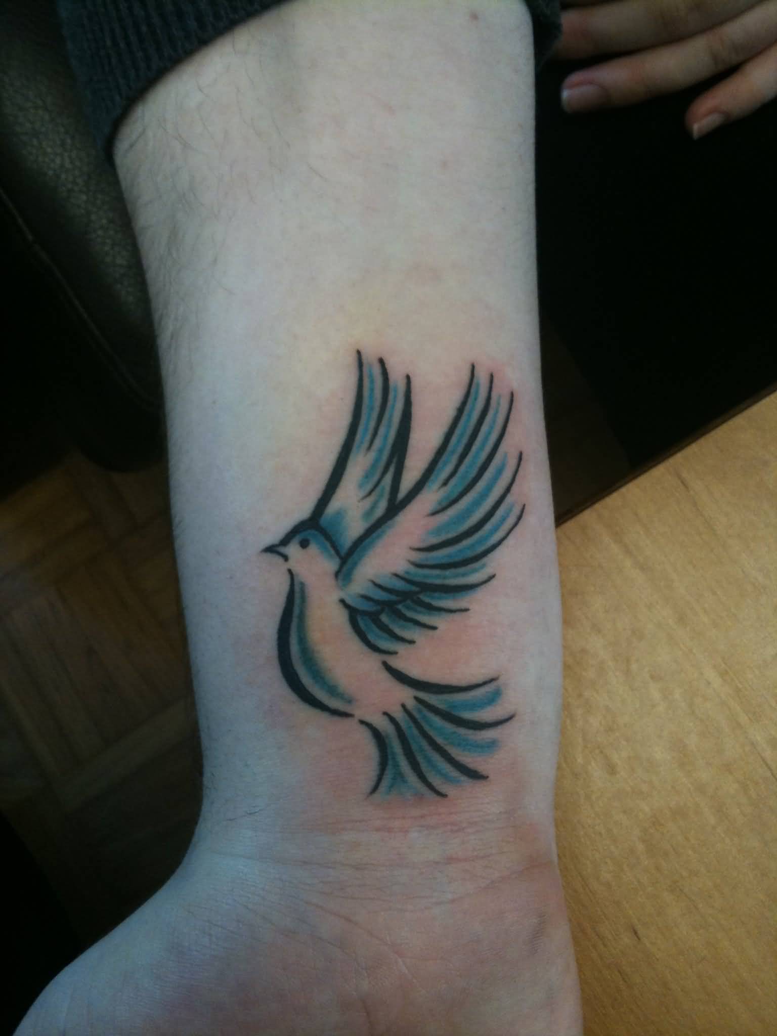 Flying Dove Tattoo On Right Wrist