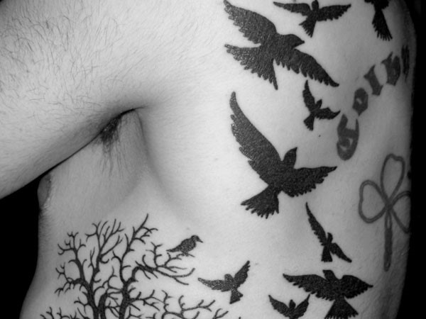 Flying Raven Tattoos On Man Back Shoulder