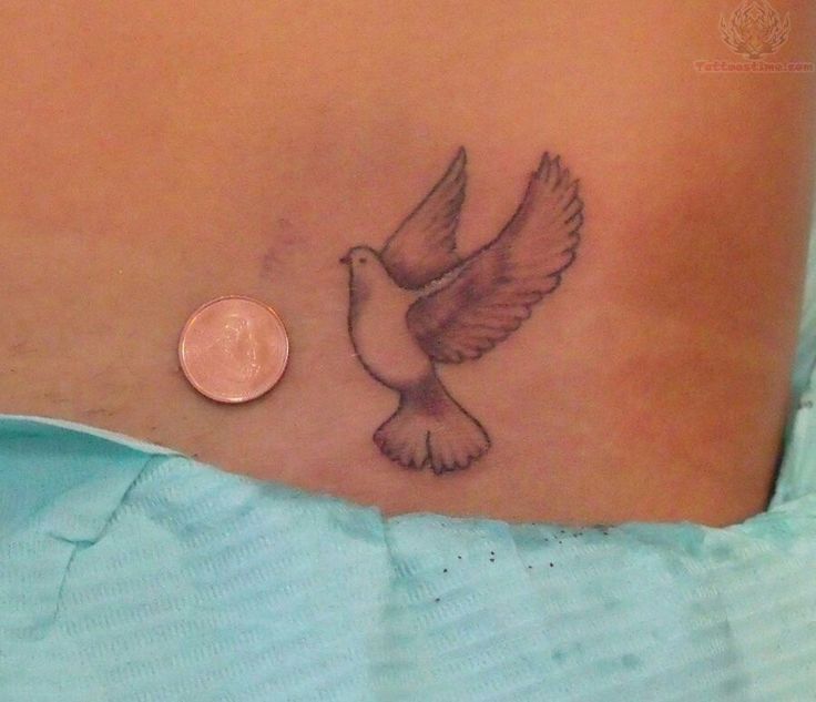 Flying Small Dove Tattoo On Lower Back