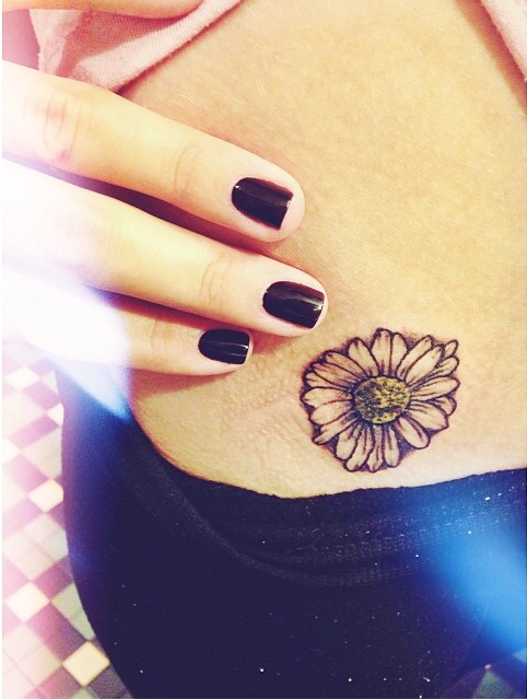 Girl With Small Daisy Tattoo On Hip