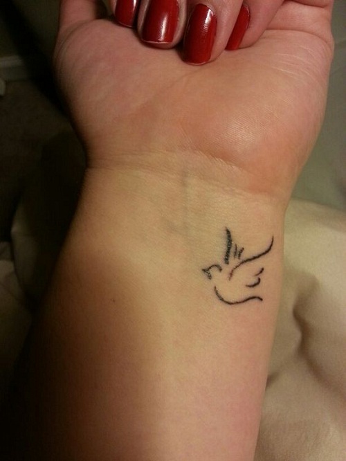 Girl With Small Small Dove Tattoo On Wrist