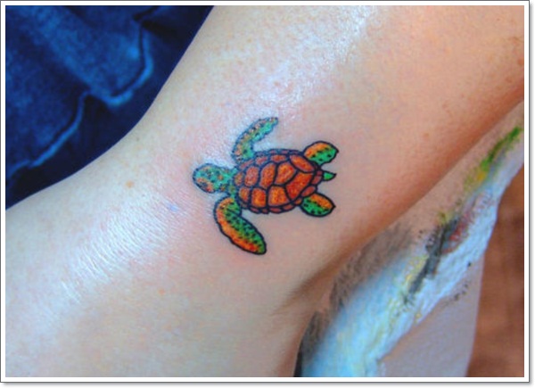 Green And Brown Ink Turtle Tattoo On Leg