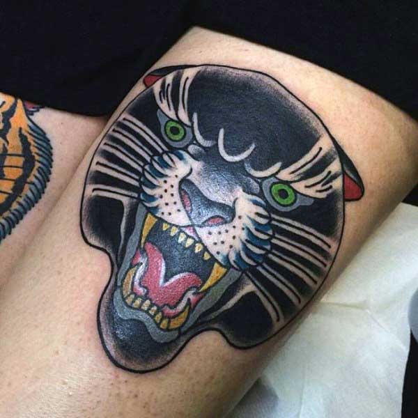 Green Eyes Panther Head Tattoo On Left Thigh