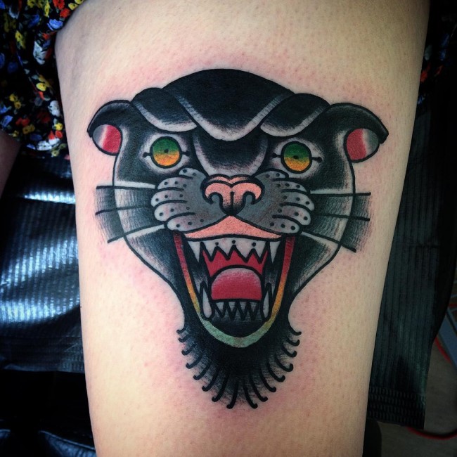 Green Eyes Panther Head Tattoo On Thigh