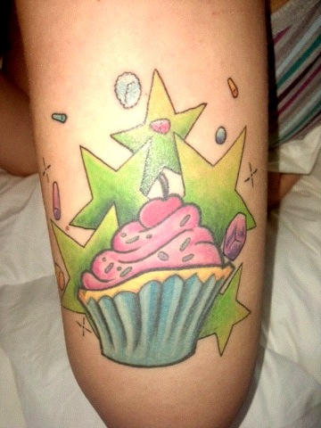 Green Stars And Cupcake Tattoo On Thigh