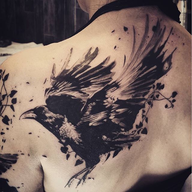 Grey And Black Abstract Raven Tattoo On Left Back Shoulder