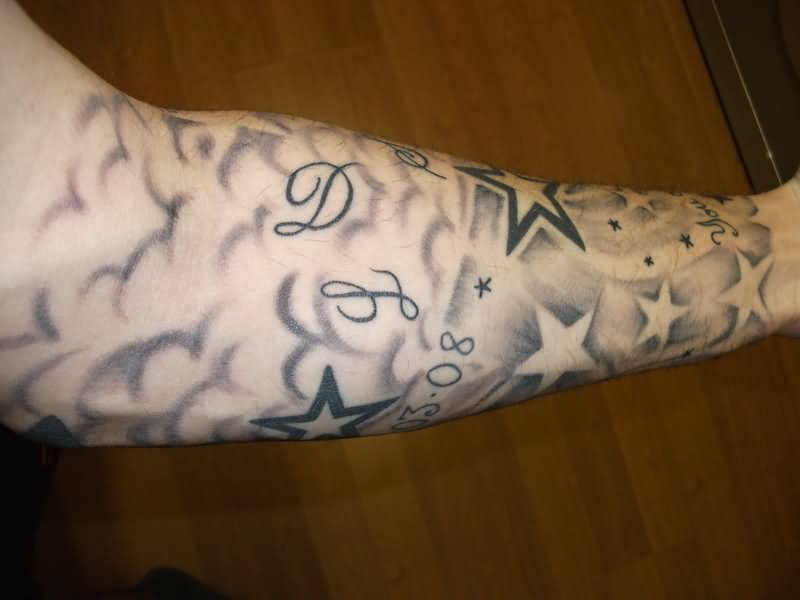 Grey And Black Clouds And Stars Tattoo On Arm Sleeve