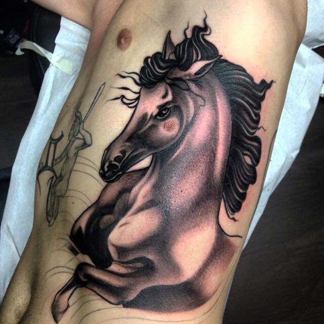 Grey And Black Horse Tattoo On Man Side Rib
