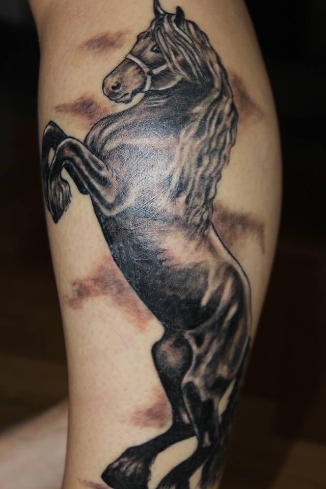 Grey And Black Jumping Horse Tattoo On Side Leg