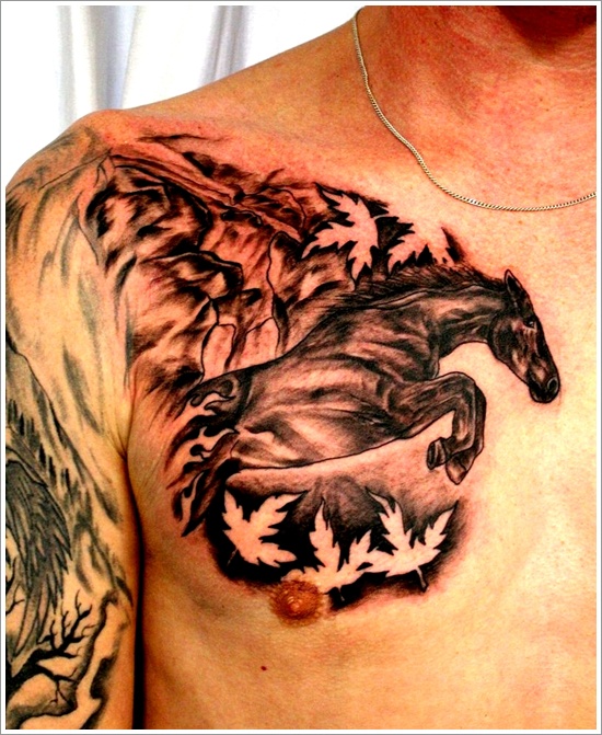 Grey And Black Maple Leaves And Running Horse Tattoo On Man Chest