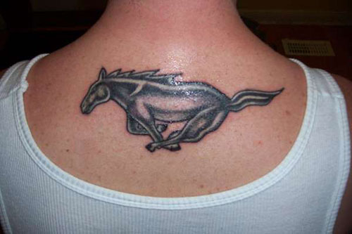 Grey And Black Running Horse Tattoo On Upper Back