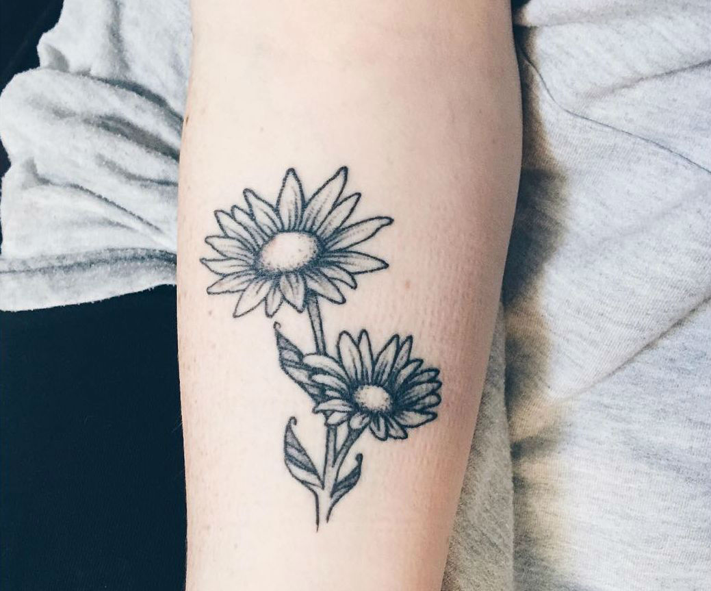 Grey And White Daisy Flower Tattoo On Forearm