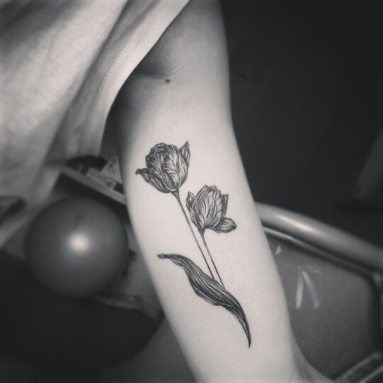 Grey And White Tulip Flowers Tattoo On Bicep