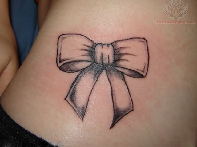 Grey Ink Bow Tattoo On Girl Lower Back