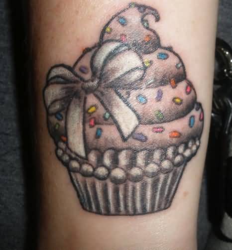 Grey Ink Cupcake Tattoo On Arm