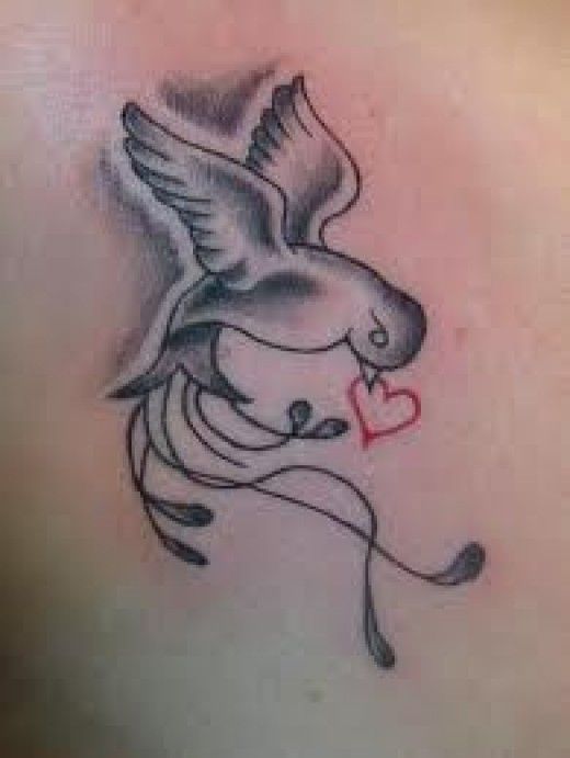 Grey Ink Dove With Heart In Beak Tattoo Idea