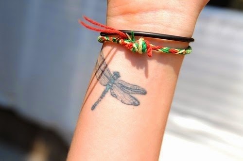 Grey Ink Dragonfly Tattoo On Girl Right Wrist