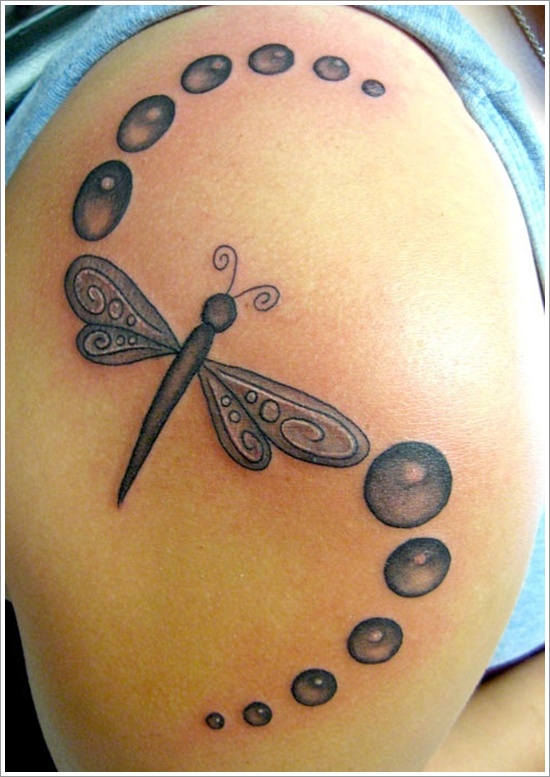 Grey Ink Flying Dragonfly Tattoo On Shoulder