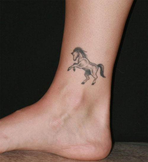 Grey Ink Horse Tattoo On Side Ankle