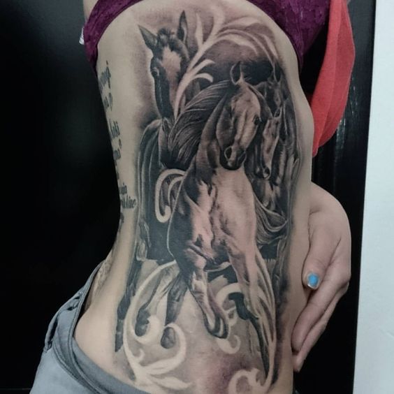 Grey Ink Realistic Running Horse Tattoo On Side Rib