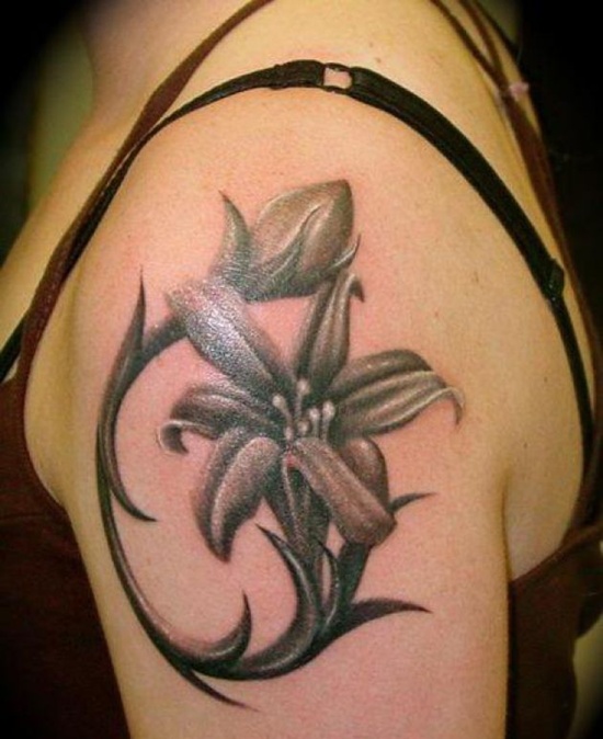 Grey Ink Small Lily Tattoo On Girl Left Shoulder