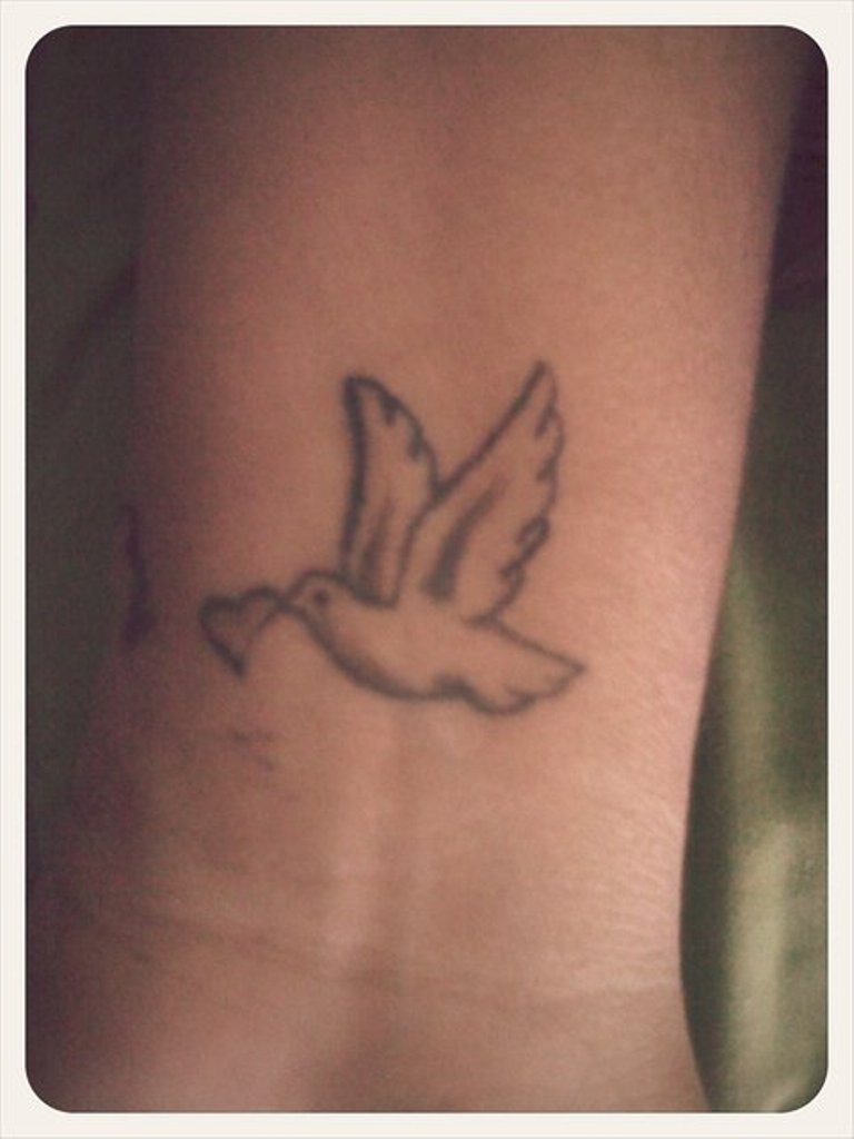 Grey Ink Tiny Heart And Flying Dove Tattoo On Right Wrist