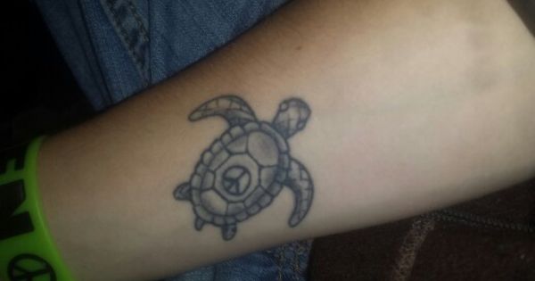 Grey Ink Turtle With Peace Symbol Tattoo On Leg