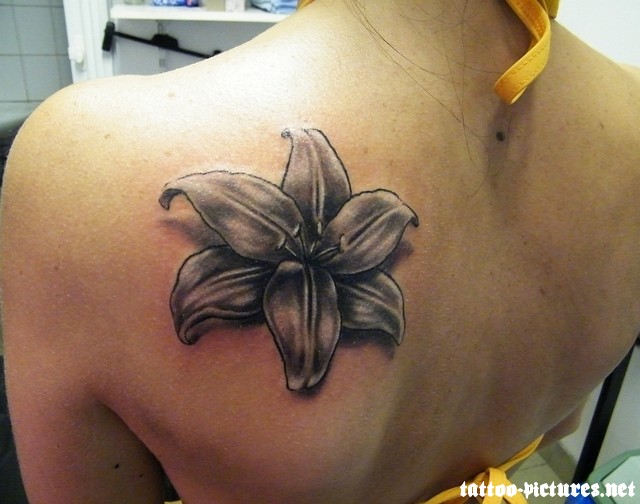 Grey Lily Flower Tattoo On Left Back Shoulder