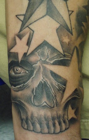 Grey Skull And Star Tattoos On Arm Sleeve