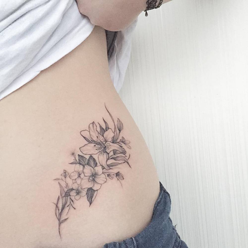 Grey Small Lily Flowers Tattoo On Lower Back