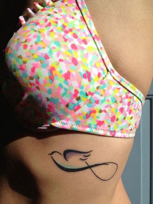 Infinity Peace Dove Tattoo On Girl Rib Side