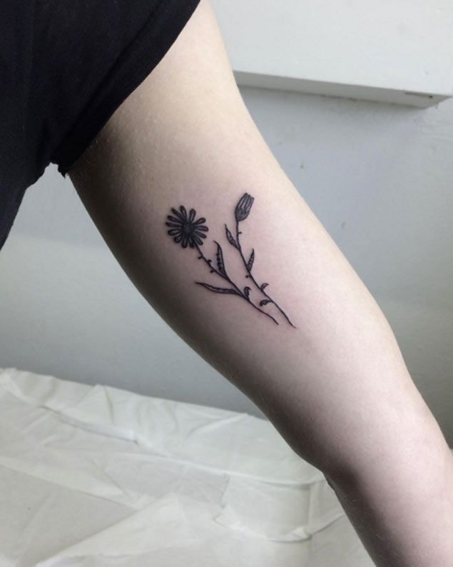 Inner Bicep Black Ink Daisy Flower Tattoo