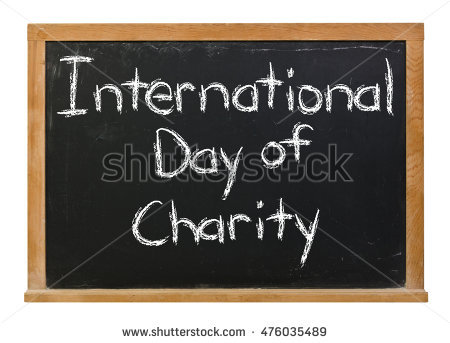 International Day Of Charity Written On Black Board With Chalk Illustration
