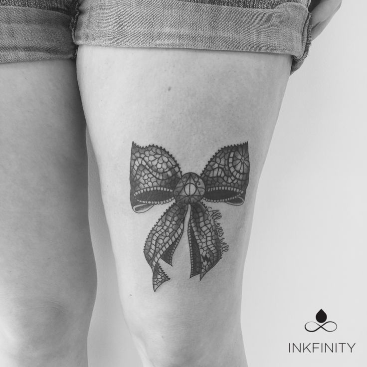 Lace Bow Tattoo On Girl Left Thigh