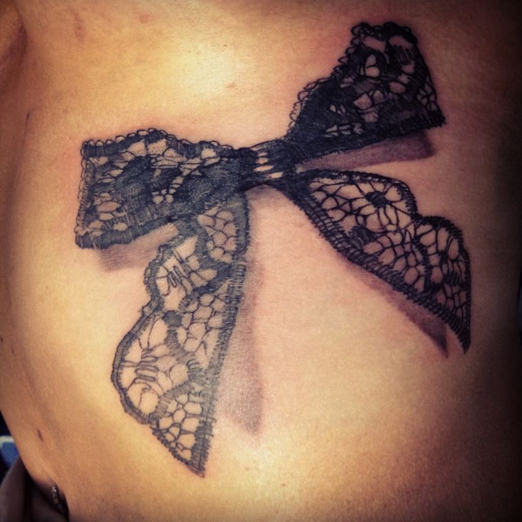 Lace Bow Tattoo On Left Shoulder