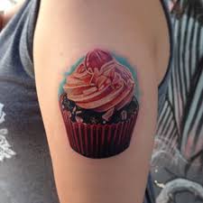 Left Bicep Colorful Realistic Cupcake Tattoo