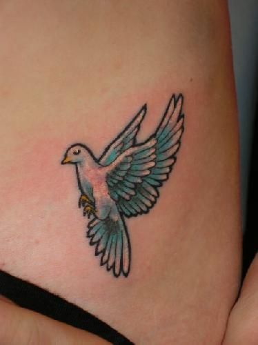 Light Blue Flying Peace Dove Tattoo On Hip