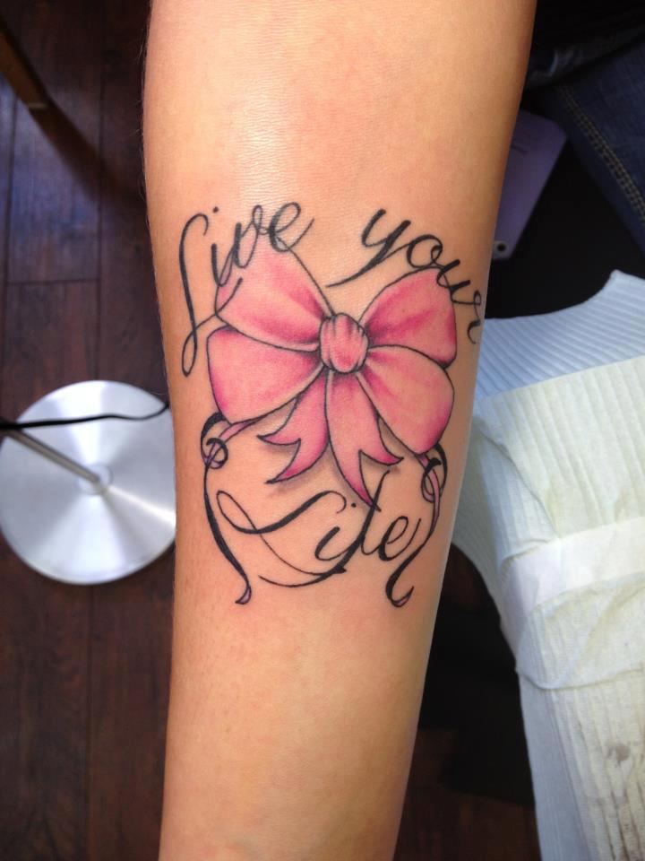 Live Your Life Pink Bow Tattoo On Arm Sleeve