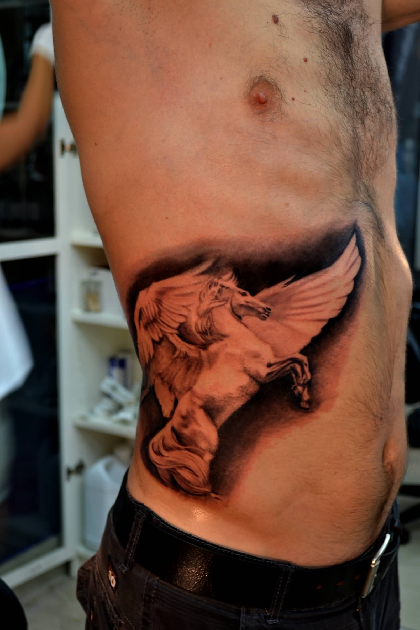 Man With 3D Horse Tattoo On Side Rib