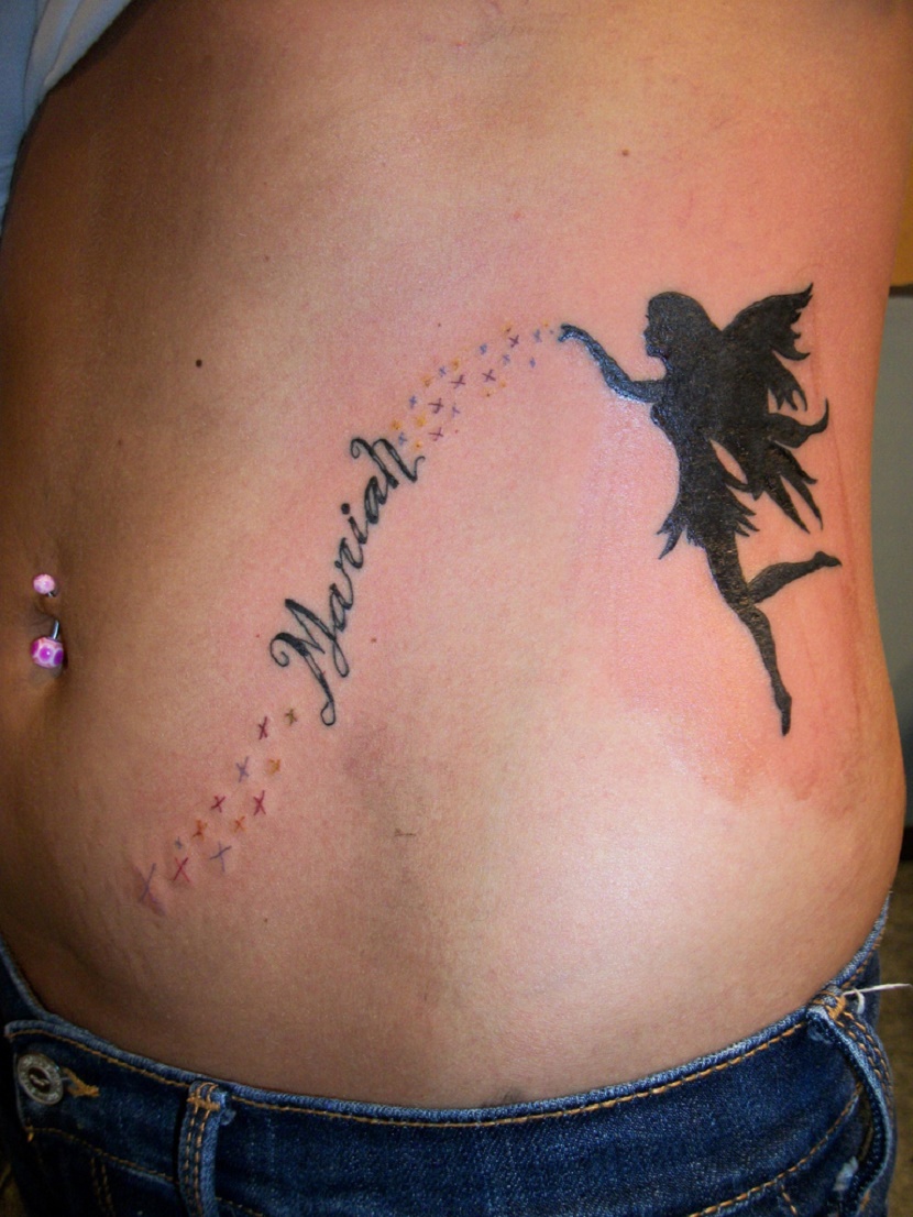 Mariah Name And Flying Fairy With Stars Tattoo On Left Hip