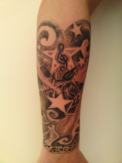 Music Notes And Skull and Star Tattoo On Arm Sleeve