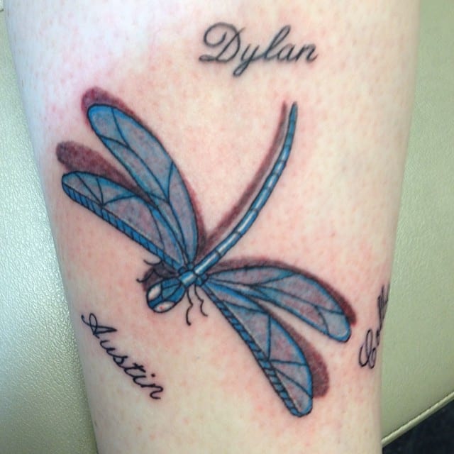 Names And Blue Dragonfly Tattoo On Leg