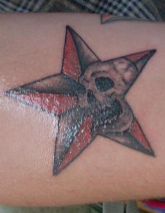 Nautical Star And Skull Tattoo On Lower Back